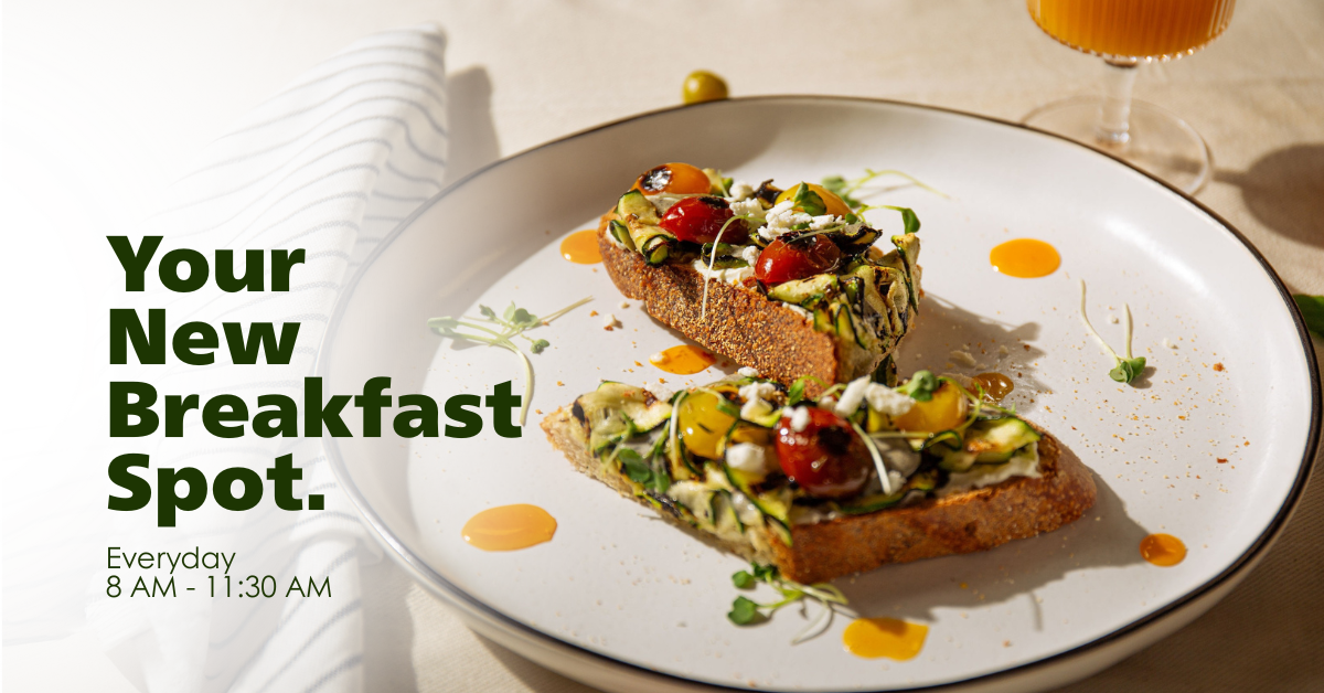 Two slices of toast with toppings on a white plate, accompanied by a glass of orange juice. Text promoting 'Your New Breakfast Spot' is displayed.